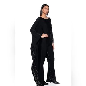 Ornate spandex jumpsuit with rhinestone details.